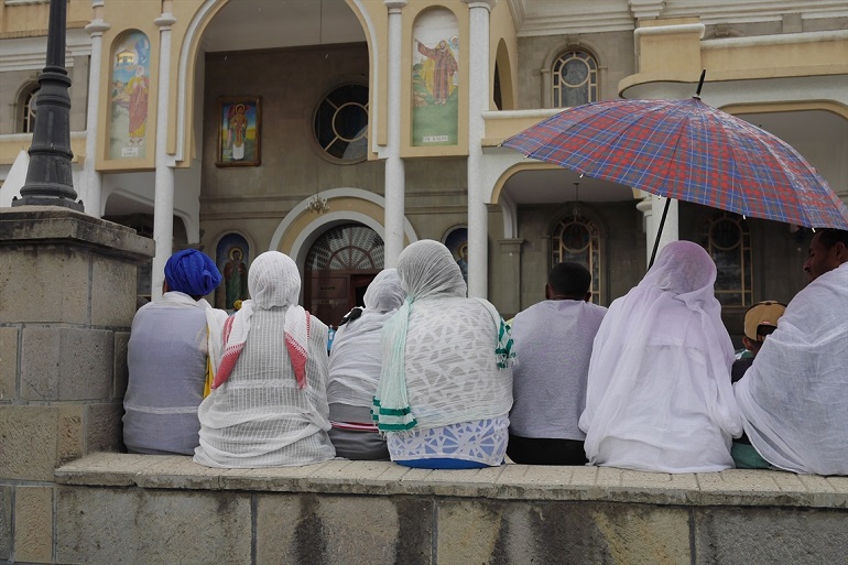 Women sitting in front of the Holy Saviour Orthodox Church in Ethiopia's capital Addis Ababa. (Photo: World Watch Monitor)