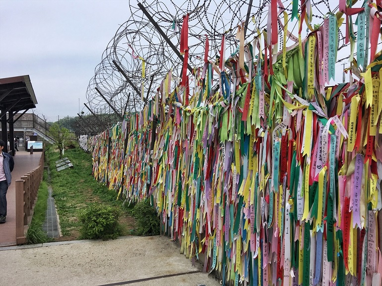 A fence at Imjingak, on the South Korean side, that separates the country from its Northern neighbour. It's filled with ribbons with prayers and wishes for North Korea and reunification written on them. (Photo: World Watch Monitor)
