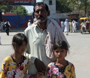 Ashiq Masih, Asia Bibi's husband, with two of their daughters (in 2010). (Photo: Courtesy of CLAAS)
