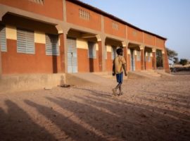 A primary schoolboy walks to school in Dori, northeastern Burkina Faso. (Getty Photo)