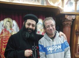Magdy Fathy Shehata Awad Allah (r) with a local priest.